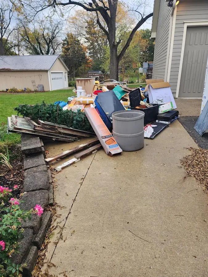 Dumpster being loaded with debris for Residential Dumpster Rental in Forestbrook